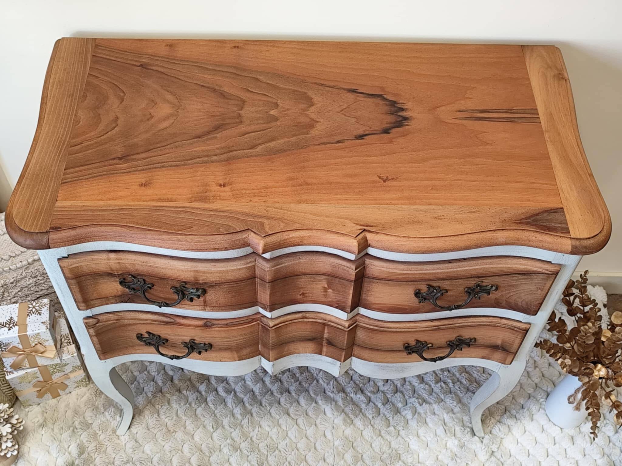 Walnut crossbow chest of drawers