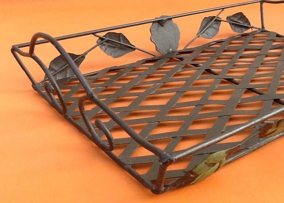 Rectangular metal serving tray with floral decoration.