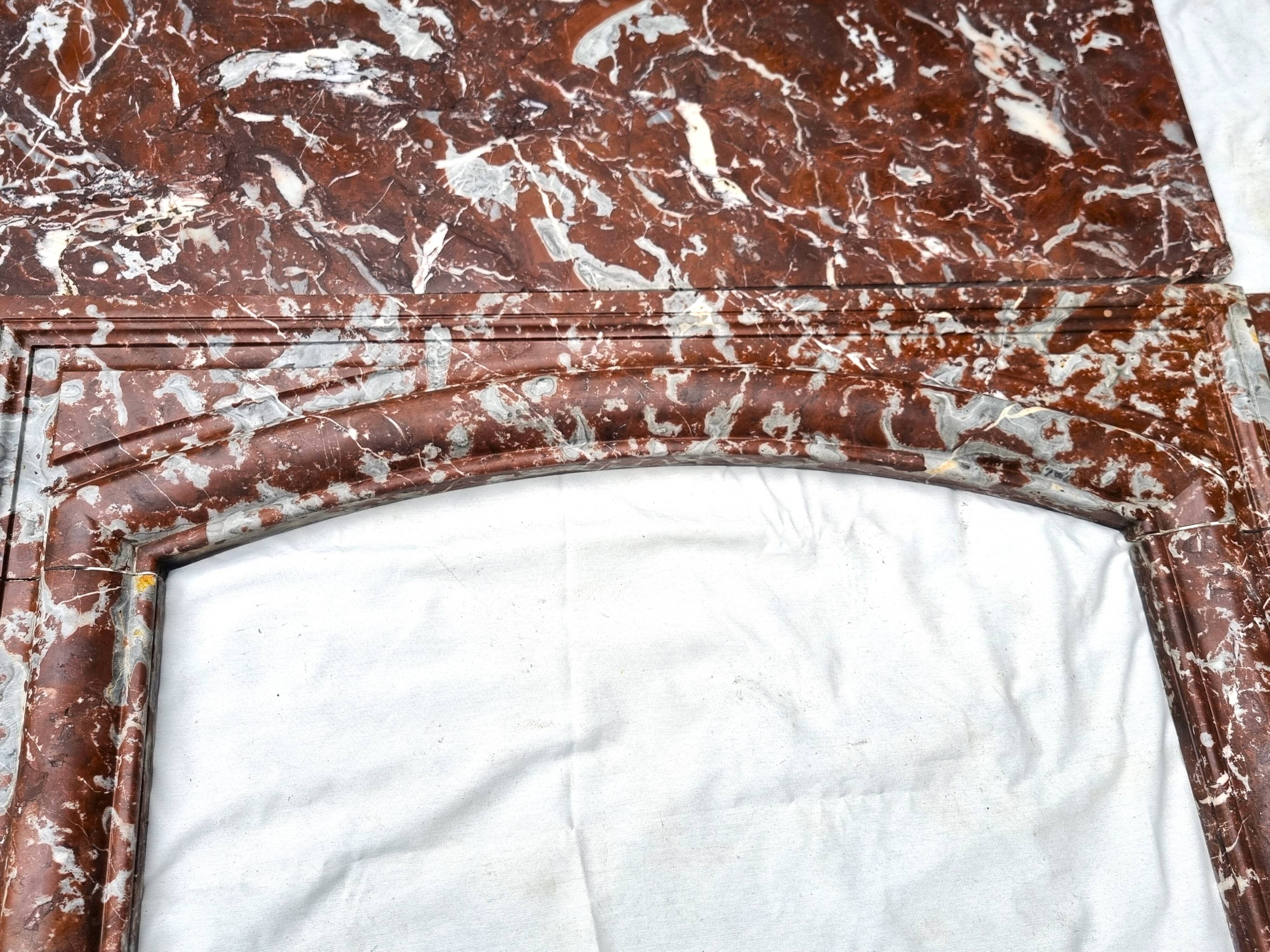 Louis XIV fireplace in Languedoc marble