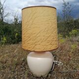 Vintage ceramic table lamp and golden lampshade.
