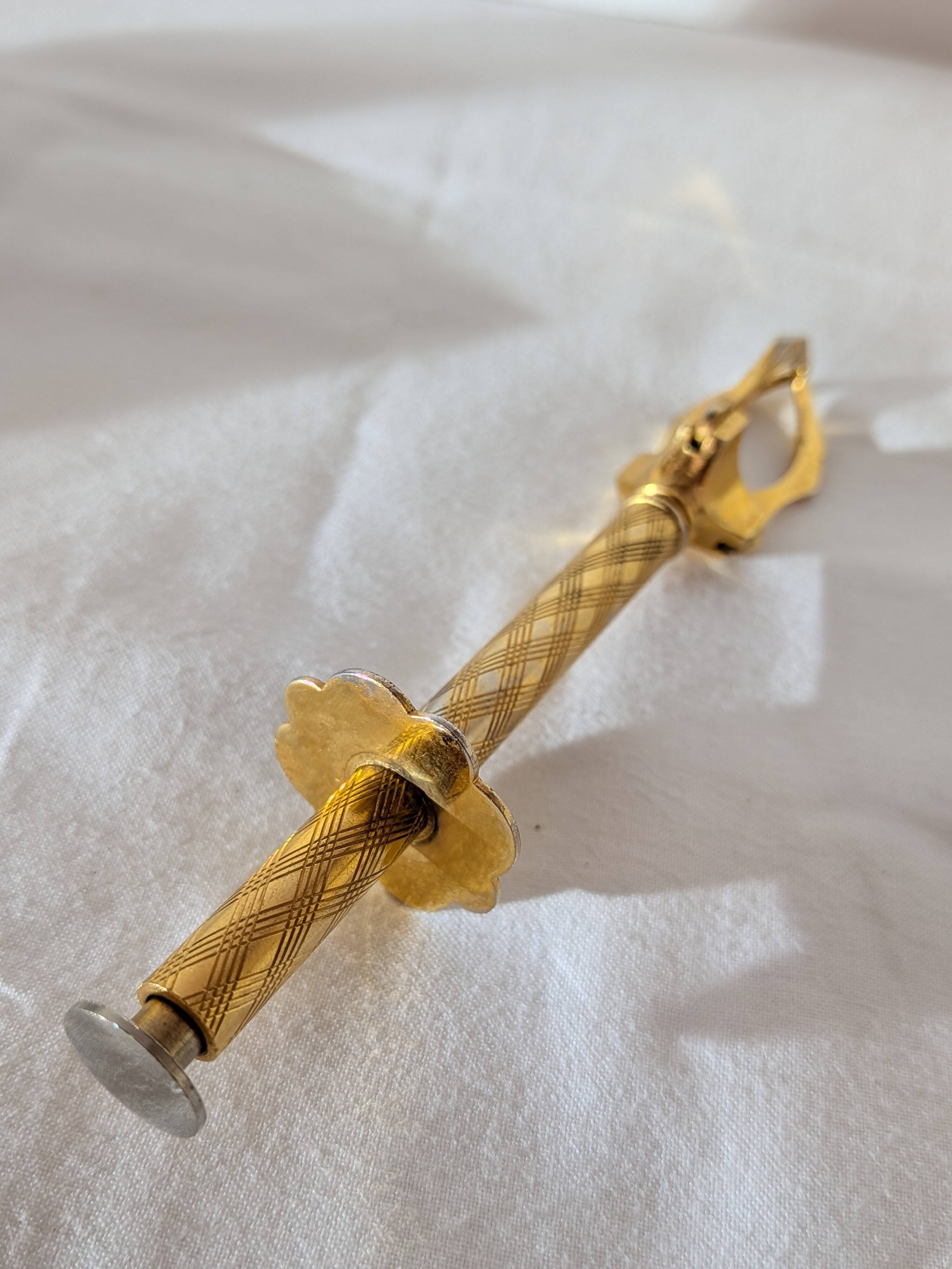 Vintage gold sugar tongs with case