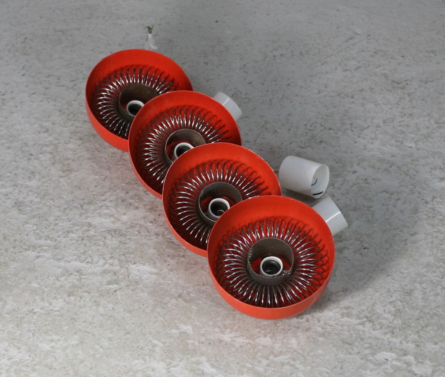 Set of 4 "spring" hanging lamps, orange steel, France, circa 1970