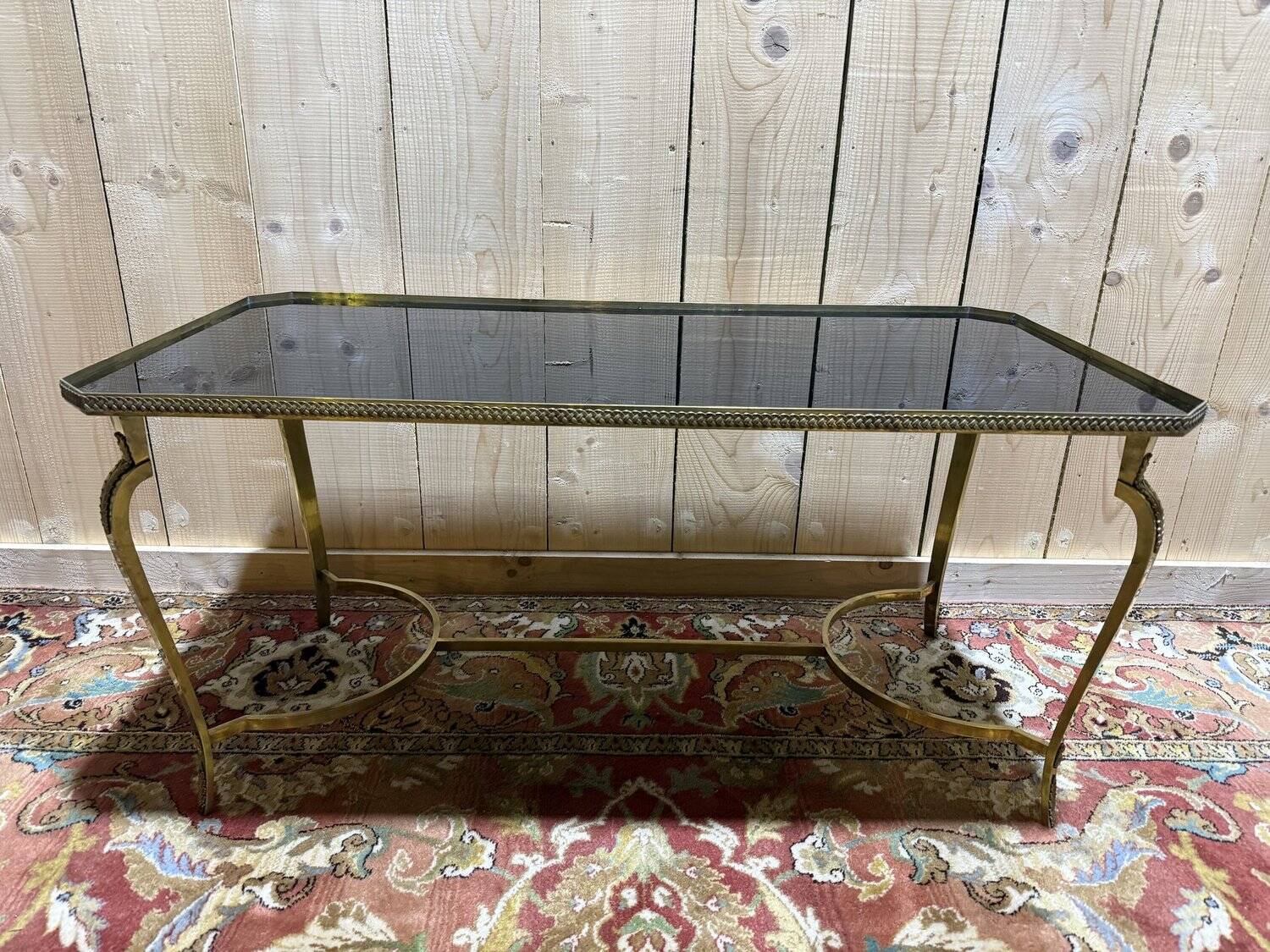 Neoclassical style coffee table with glass