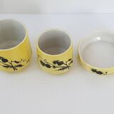 A yellow Art Deco ceramic tobacco service decorated with thistles from the 1920s to 1930s.