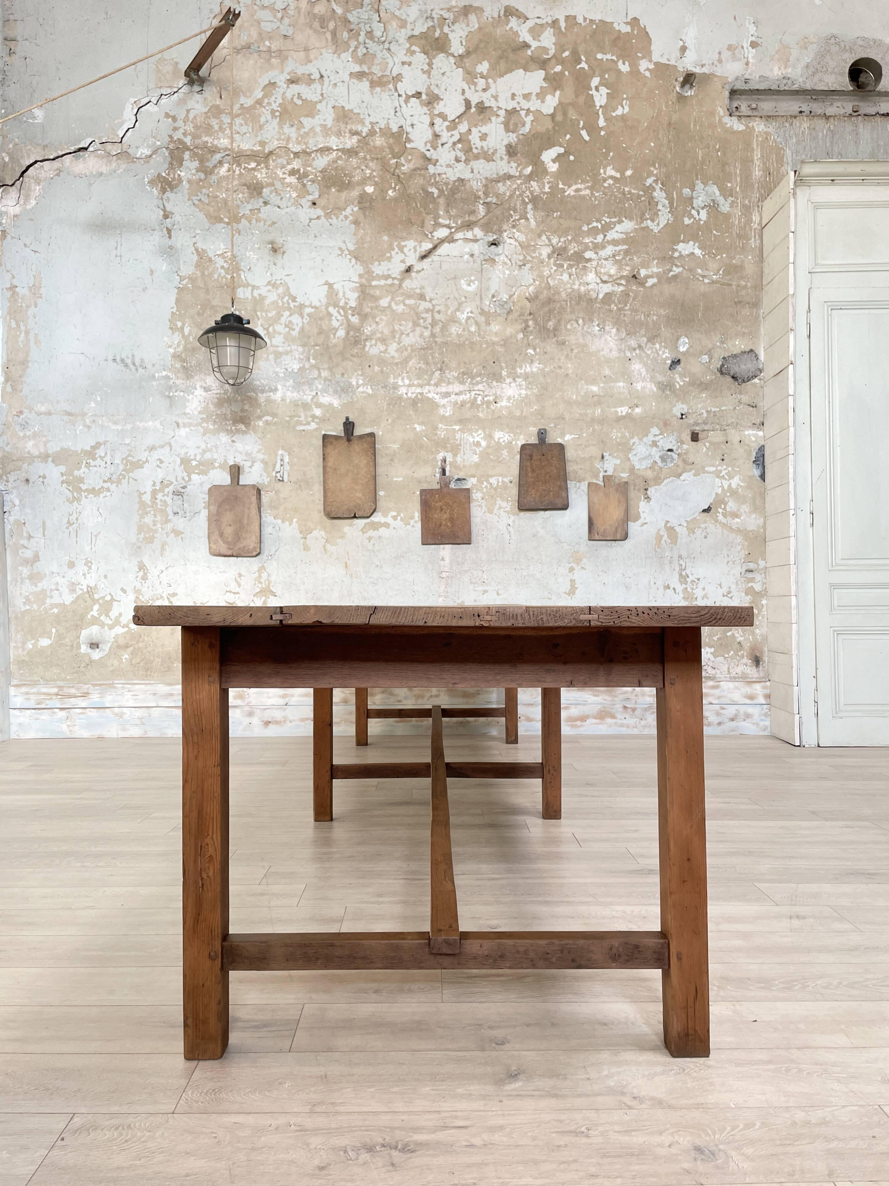 Solid wood workshop table with straight legs.