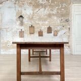 Solid wood workshop table with straight legs.