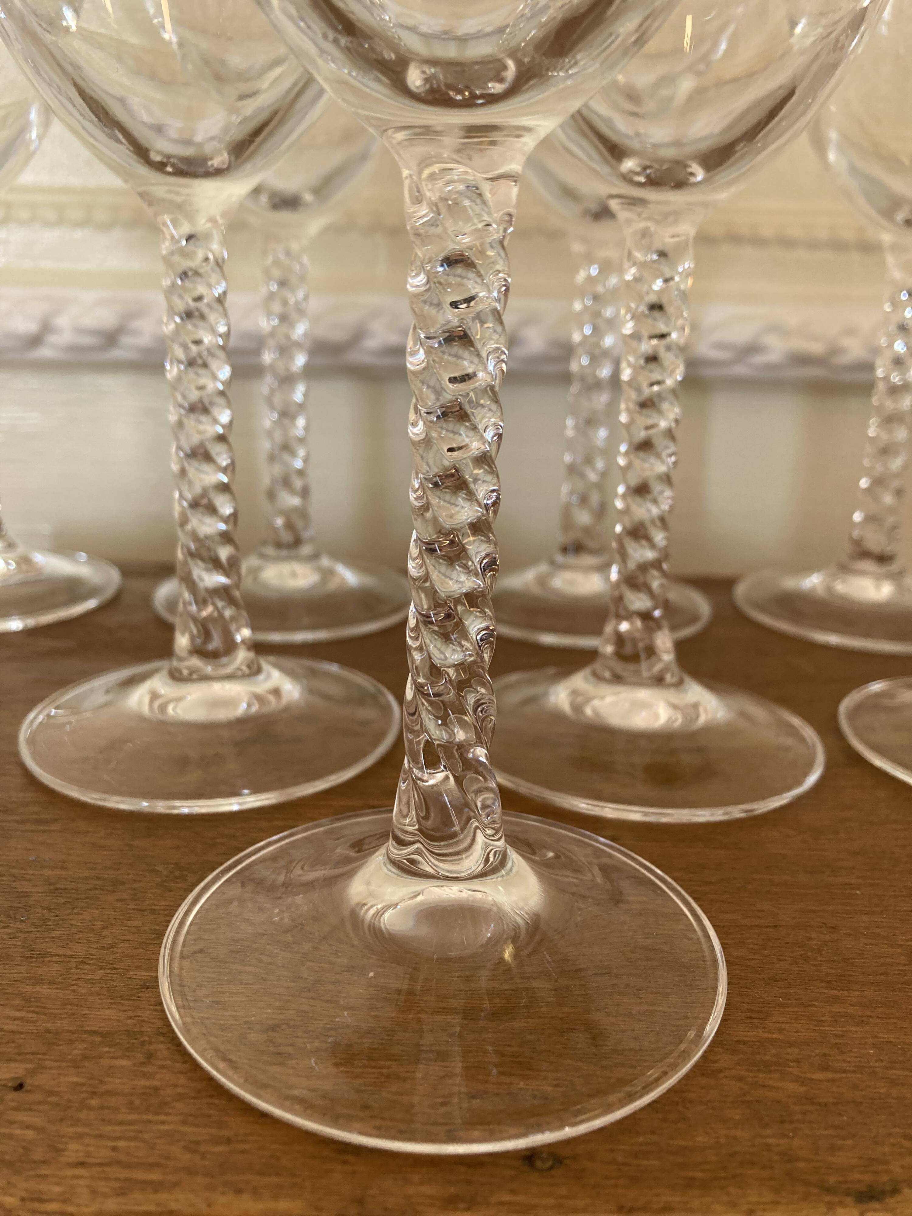 Set of 9 tall twisted and engraved crystal wine glasses