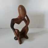 Wooden statuette sculpture of a thinking man design