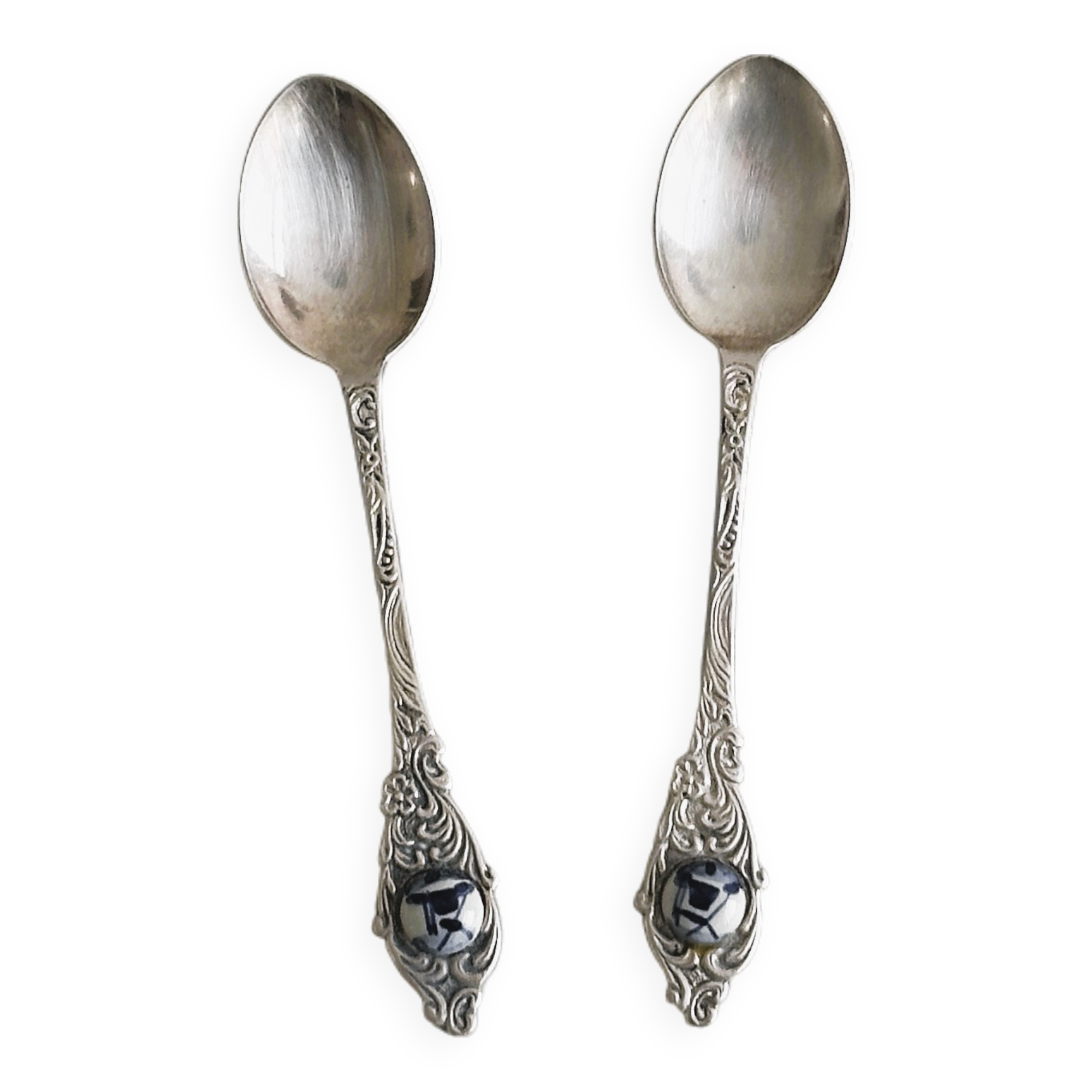 Two small metal spoons