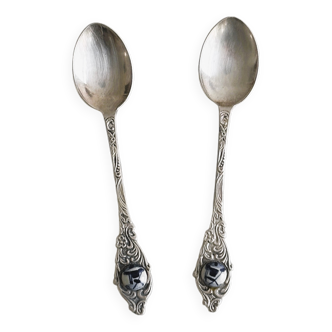 Two small metal spoons