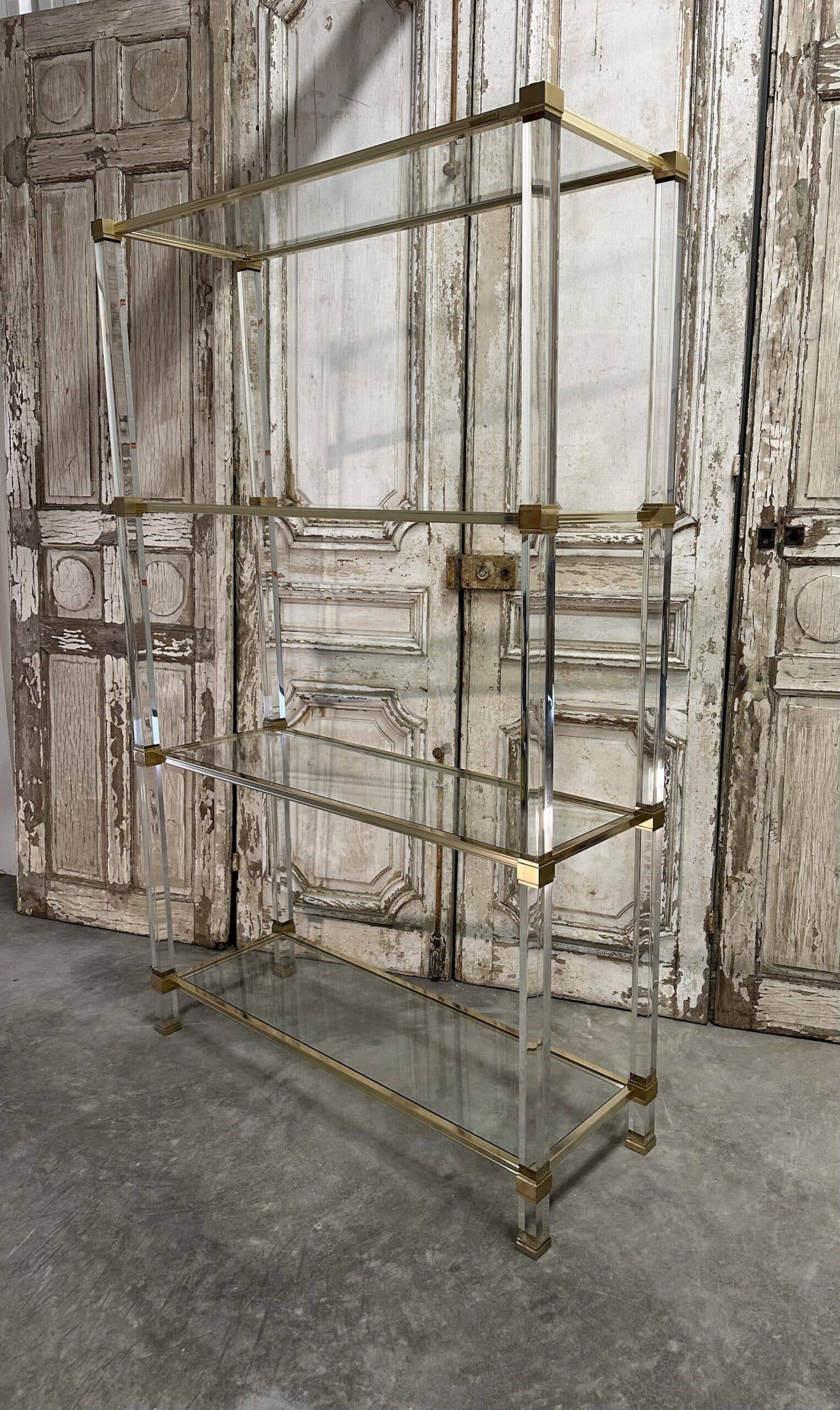 Plexiglass shelf by Pierre Vandel in Hollywood Regency style circa 1970.