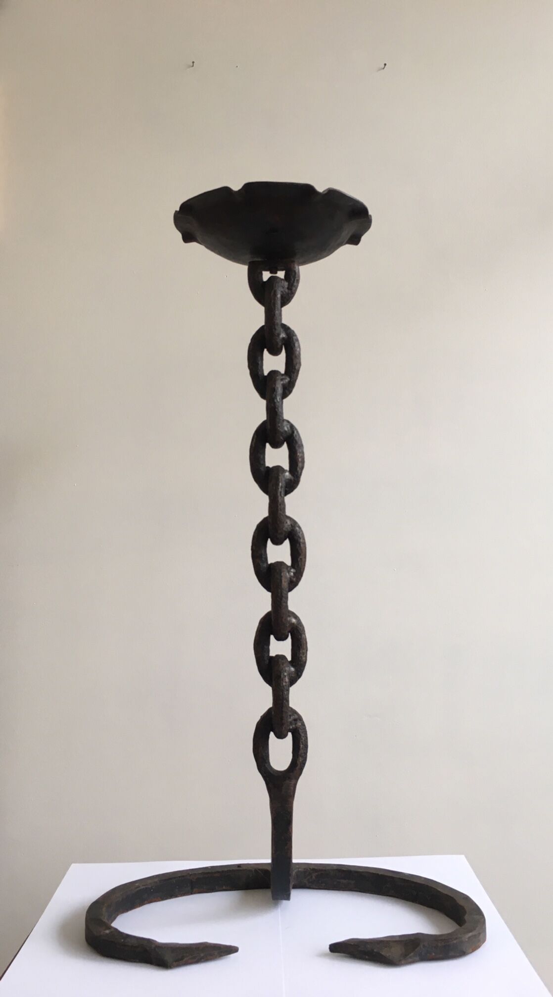 Wrought iron ashtray on its chain and anchor foot