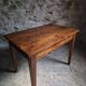Old French table in cherry wood with bistro chair, circa 1900–1930.