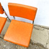 Series of 4 retro chairs in imitation orange leather MCA K6 - chrome tube structure