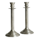 Patinated silver-plated metal candlesticks