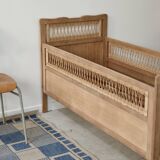 Children's bed in wood and sandblasted rattan from the 1960s.