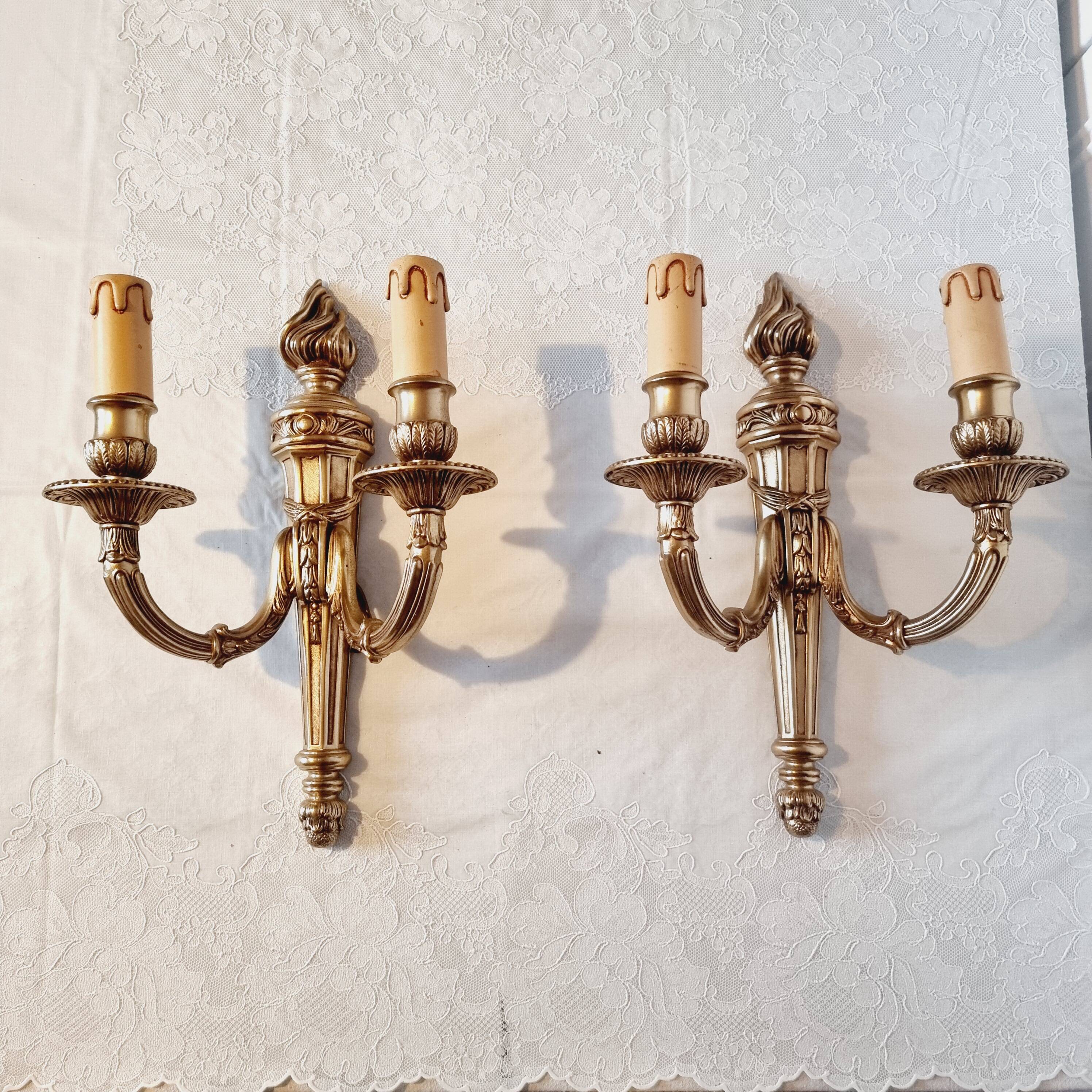 Pair of Louis XV style rocaille two-armed sconces in gilded bronze