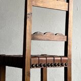 2 brutalist carved wood dining chairs with leather seat | The Netherlands | 1970s