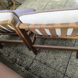 Pair of solid wood and leather lounge chairs, European work, circa 1970.