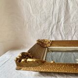 Old wall frame in carved gilded wood