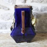 Slip vase decorated with flowers