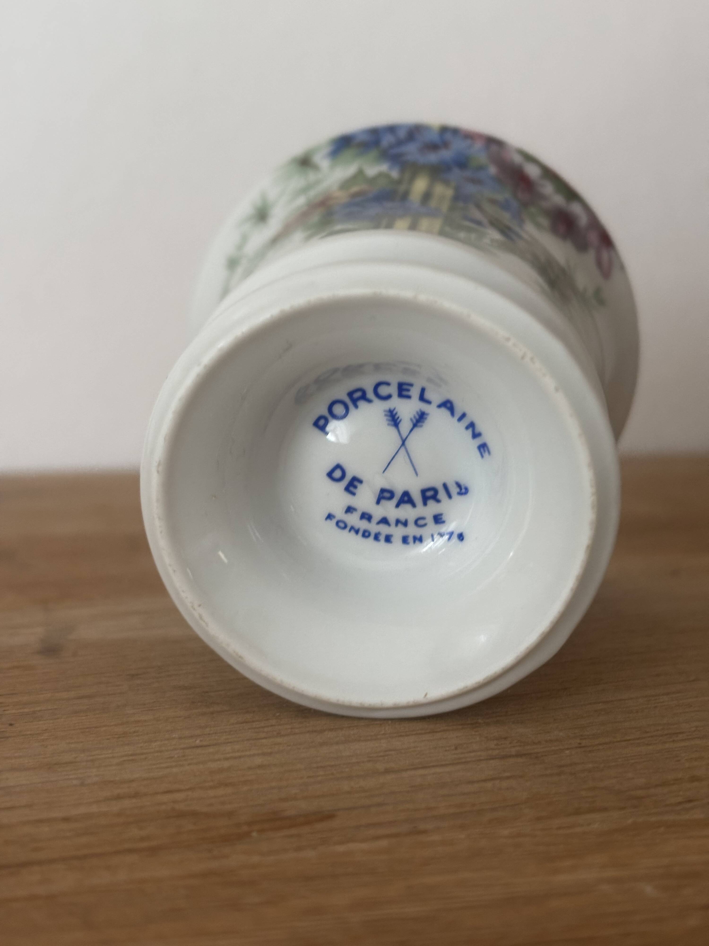 Adorable small porcelain vase from Paris with floral decoration.