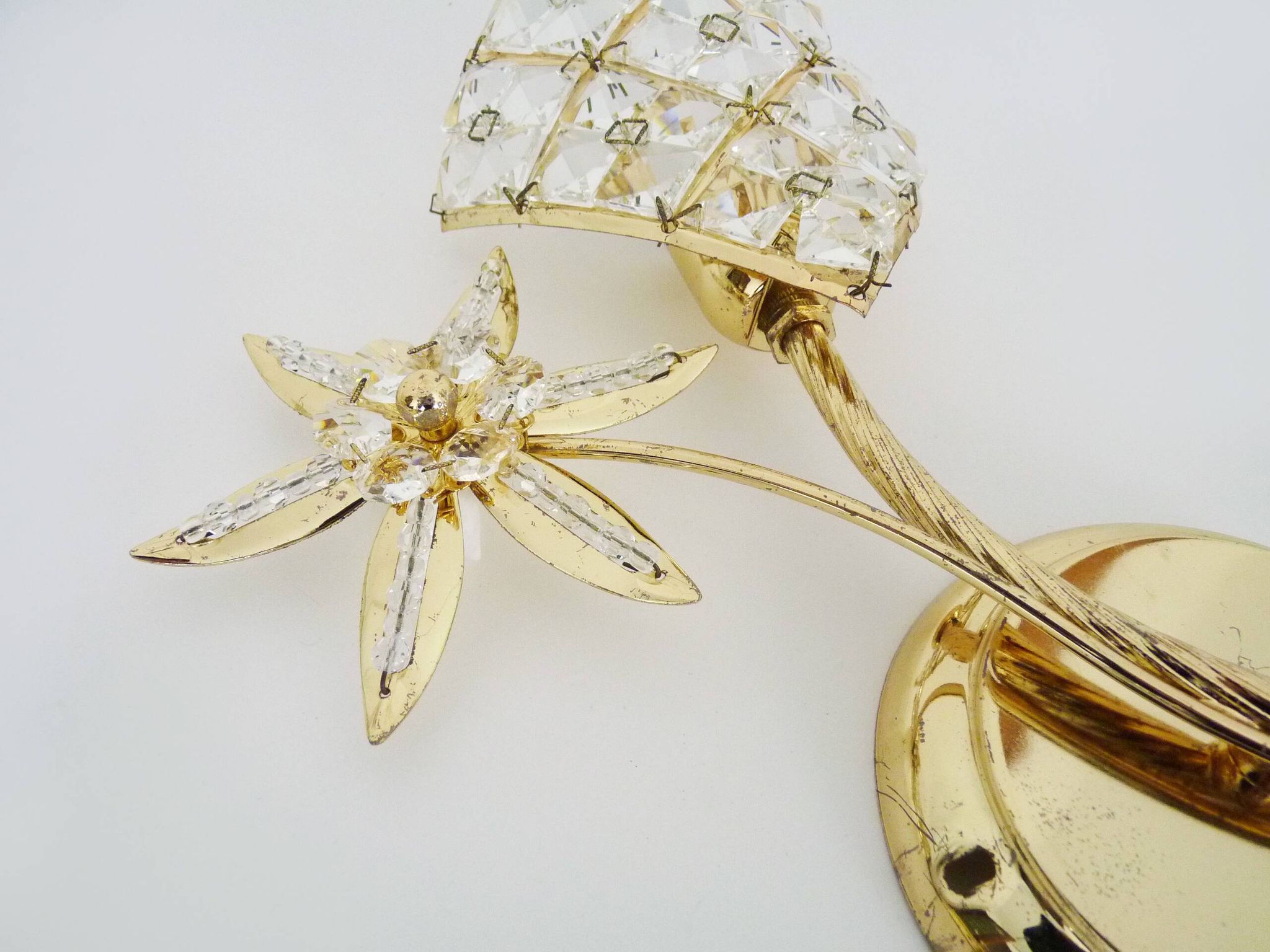 Pair of vintage floral wall sconces in gold metal and tassel