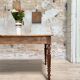 Vintage farmhouse table with turned legs.