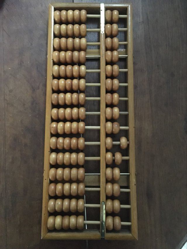 Vintage abacus made of light wood.
