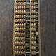 Vintage abacus made of light wood.
