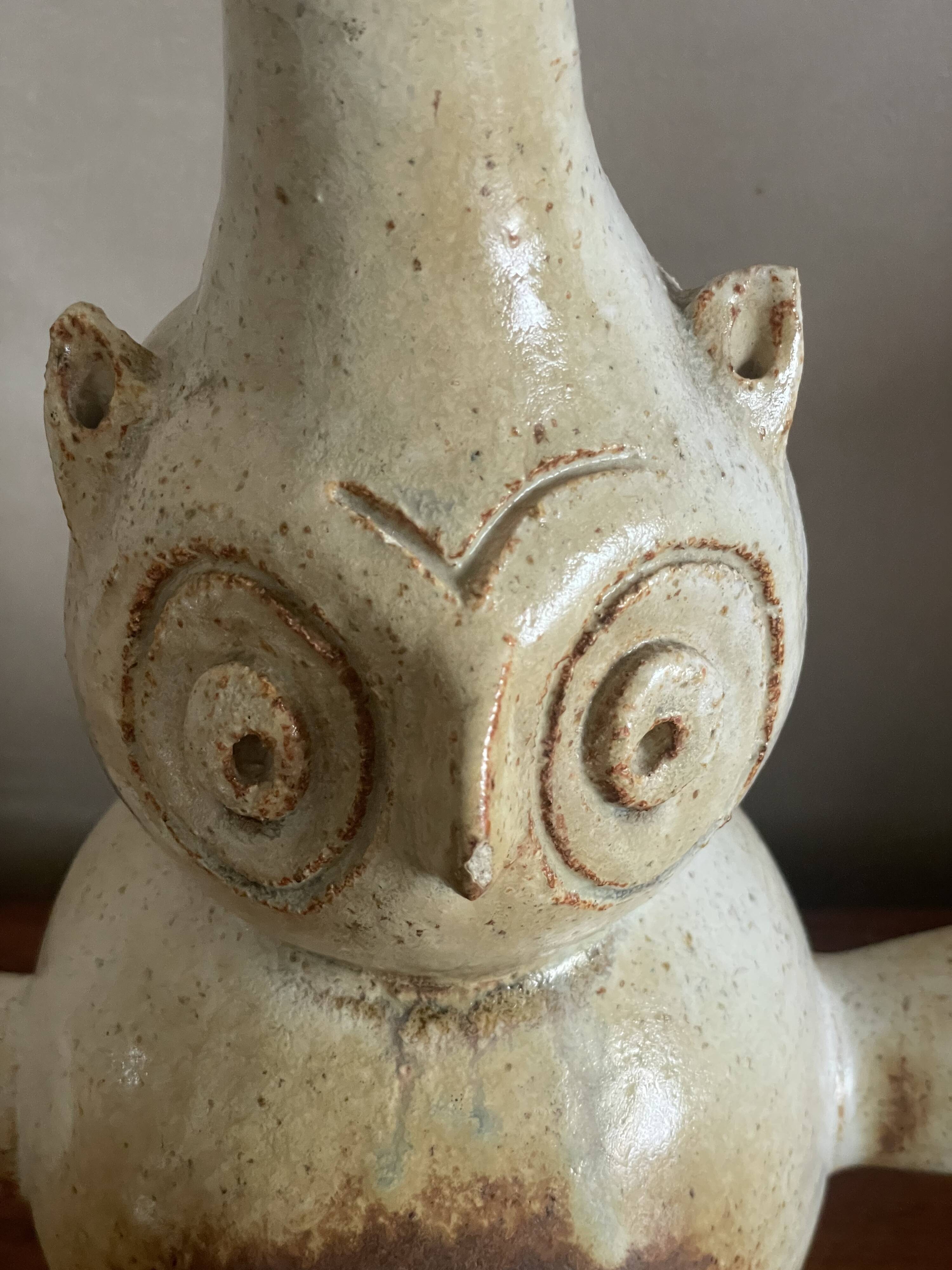 Zoomorphic owl base in sandstone