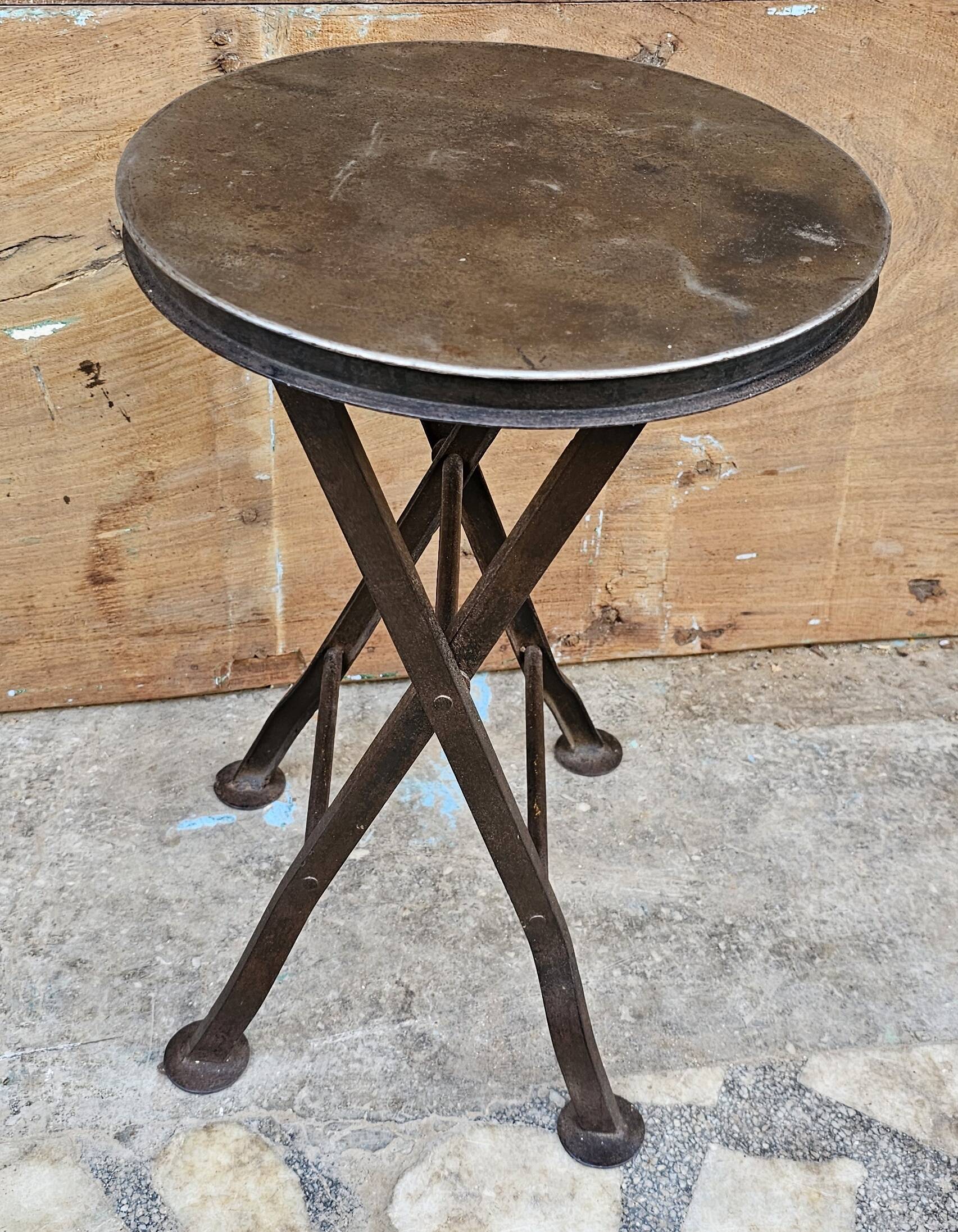 Old industrial folding steel stool