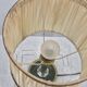 Brass table lamp with green patina and empire-style fabric shade.