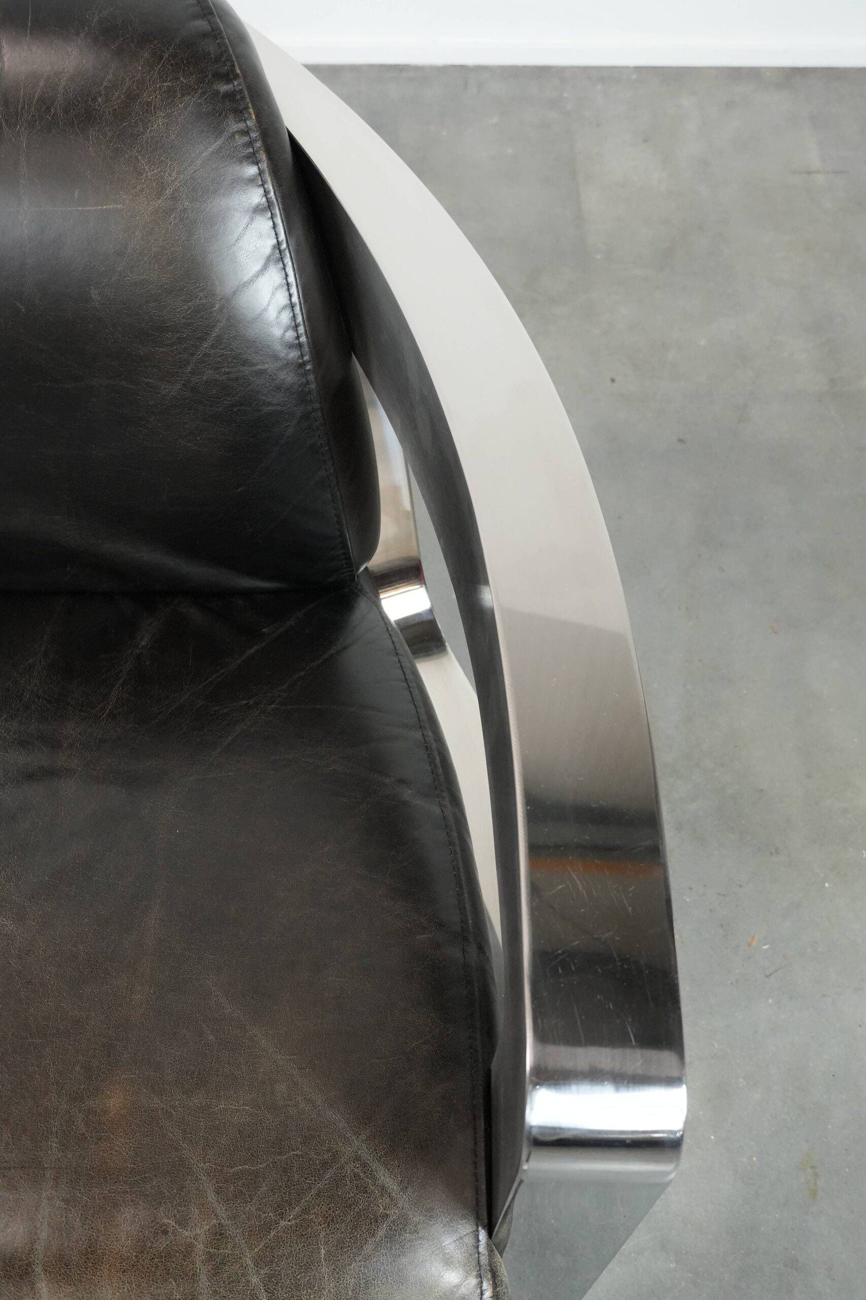 Set of two cowhide leather Aviator design armchairs with aluminium
