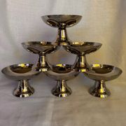 Set of 6 stainless steel ice cream bowls by Guy Degrenne with matching spoons.