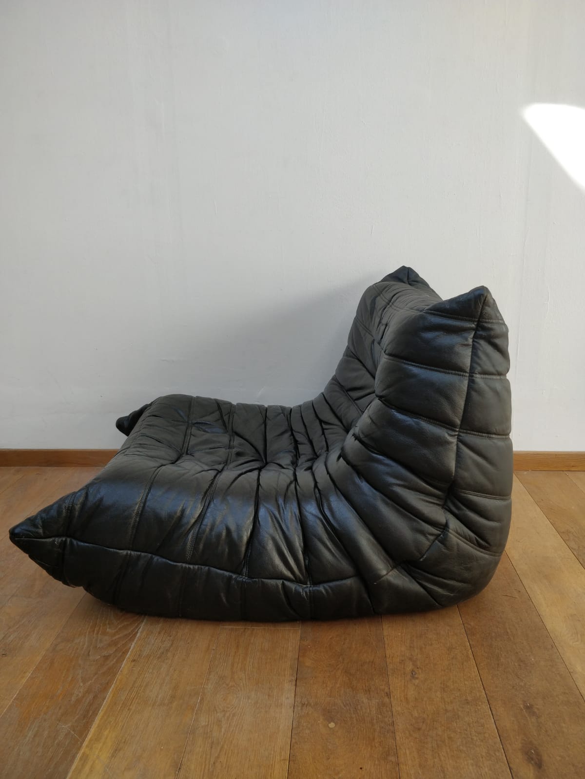 Togo in black leather by Ligne Roset