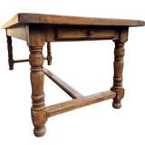 Large farmhouse table made of solid wood.