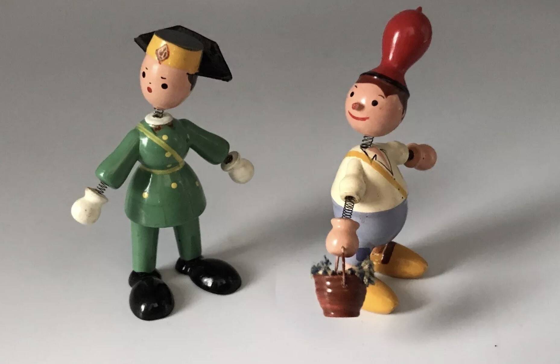 Set of 2 vintage GOULA wooden toy figurines with spring.