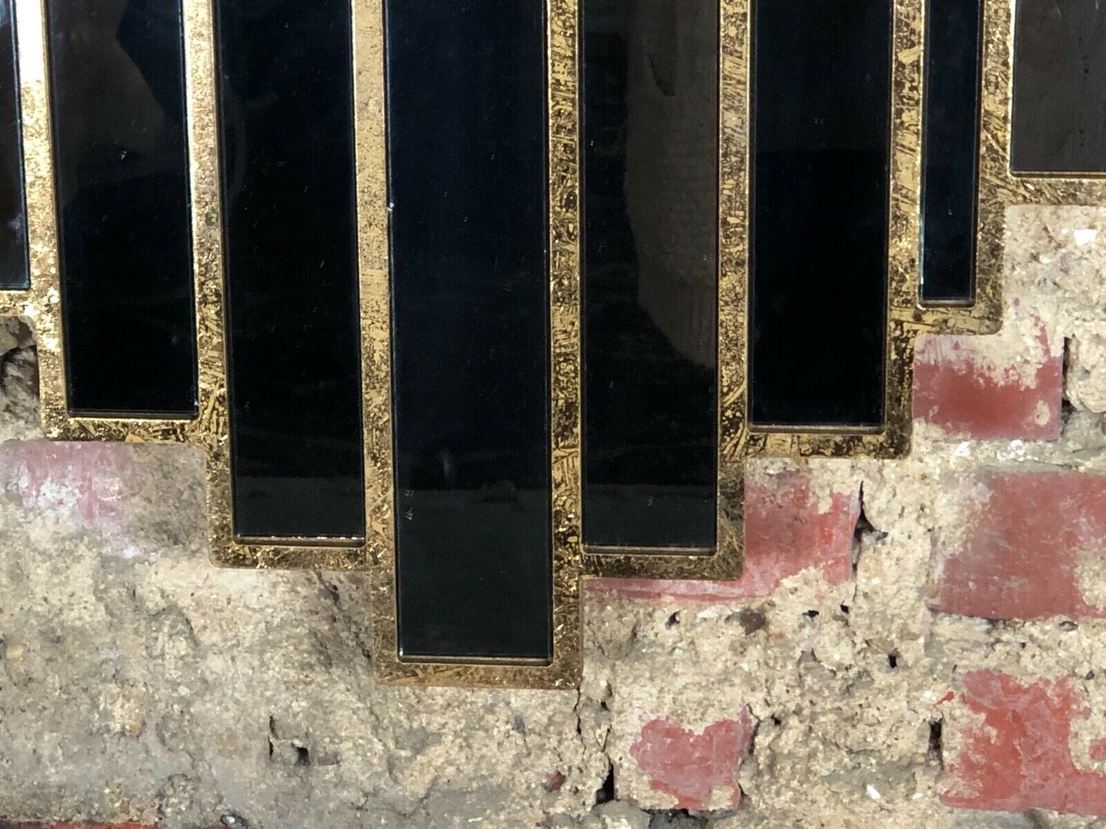 Art deco style "miami" mirror in patinated gilded wood 80x52cm