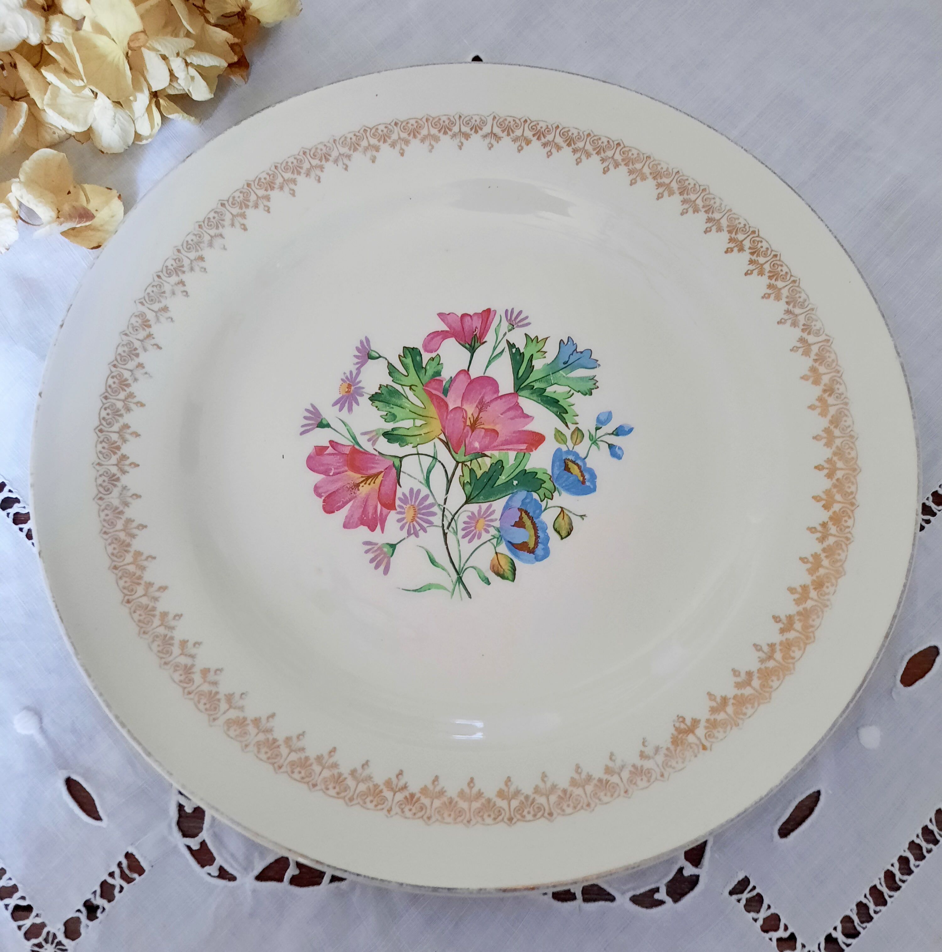 Mismatched old flat plates with gold