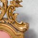 Italian rococo-style headboard in carved gilded wood, 19th century.