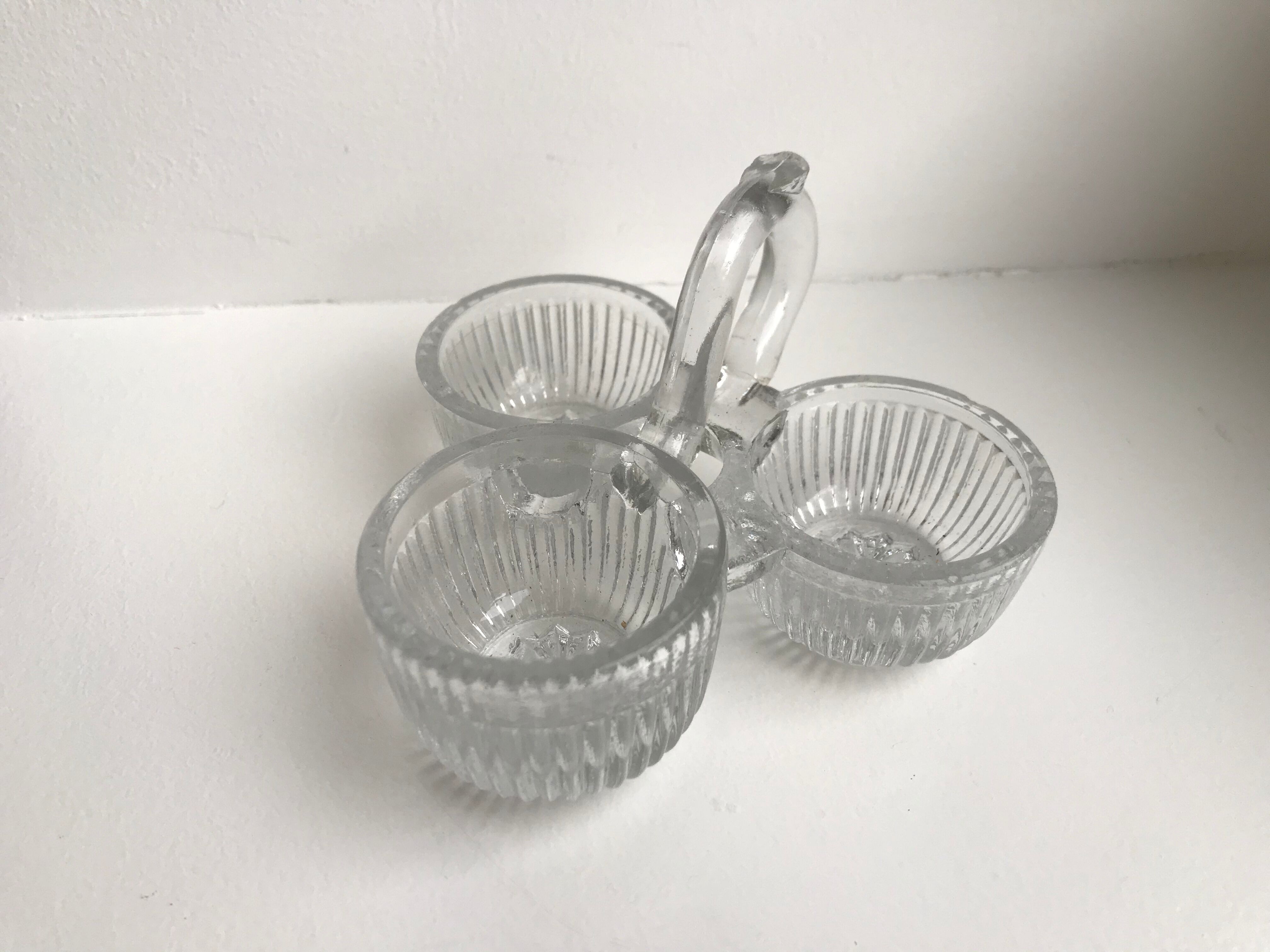 Trio of mismatched salt shakers in molded pressed glass 50s