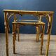 Pair of nesting tables in faux bamboo with glass tops, France, 1960s.