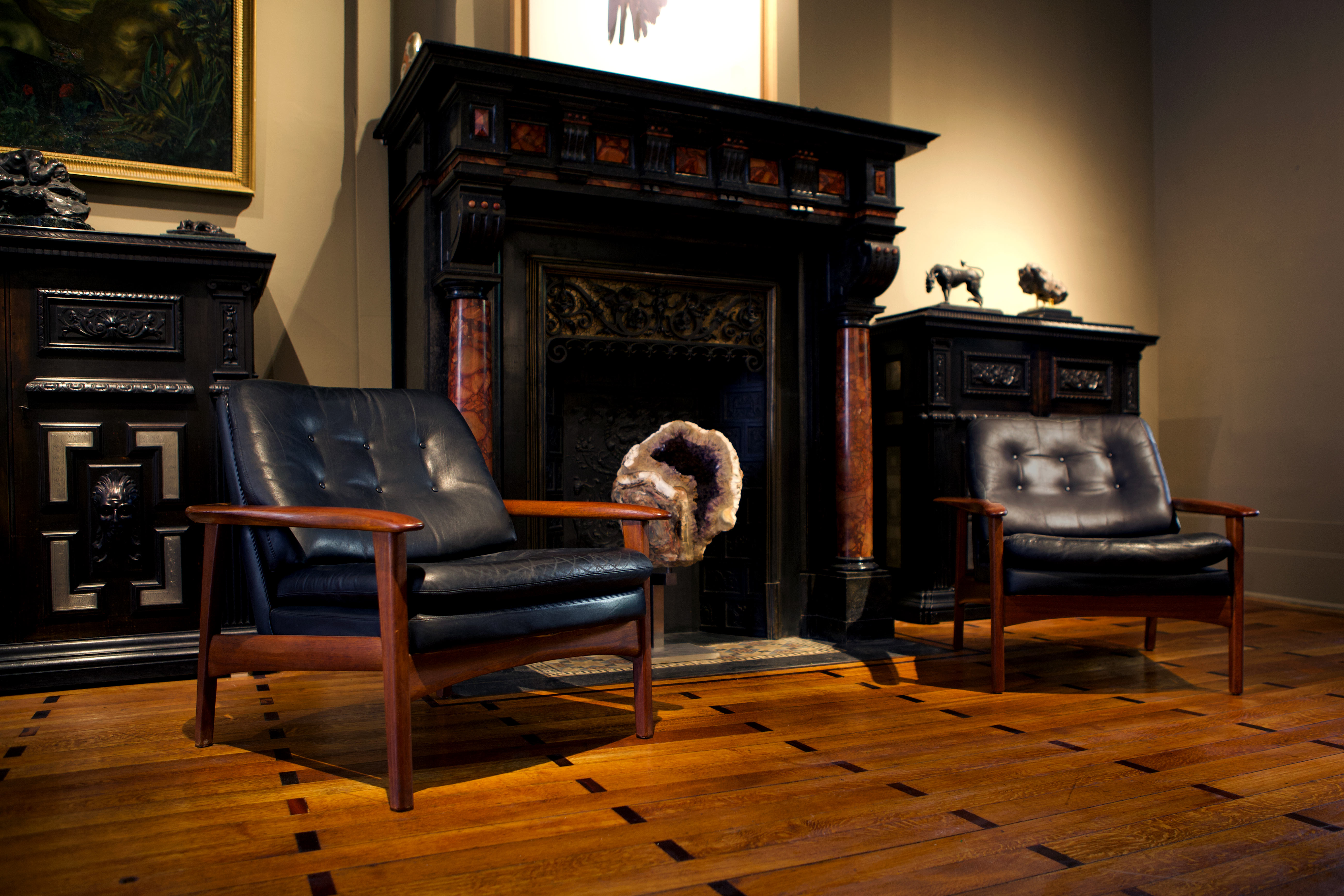 Pair of scandinavian armchairs in black leather and teak