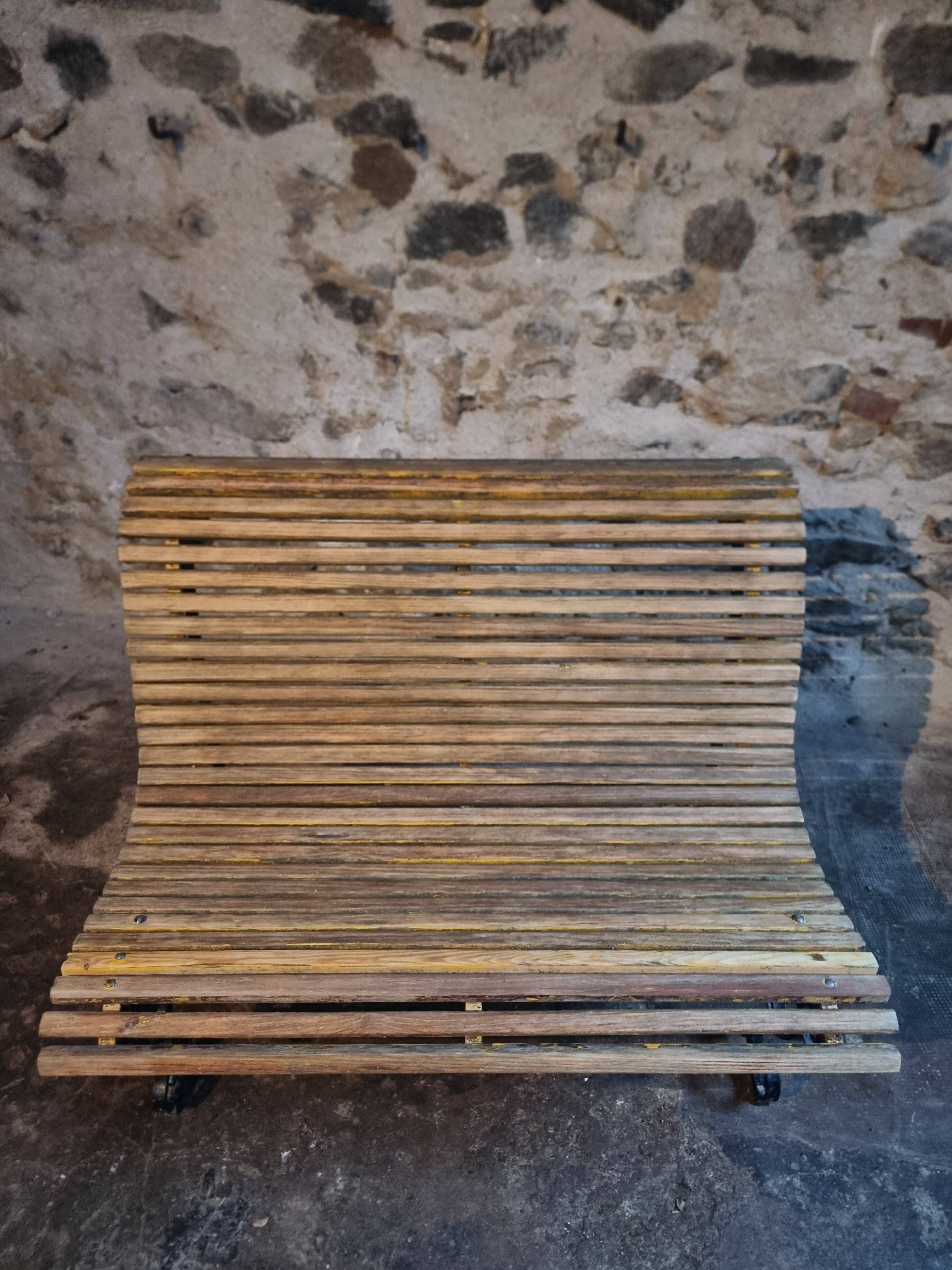 French garden bench in iron and wooden slats, mid-20th century.