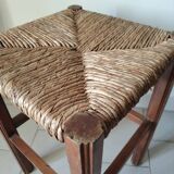 Antique campaign stool in solid wood with a straw seat.
