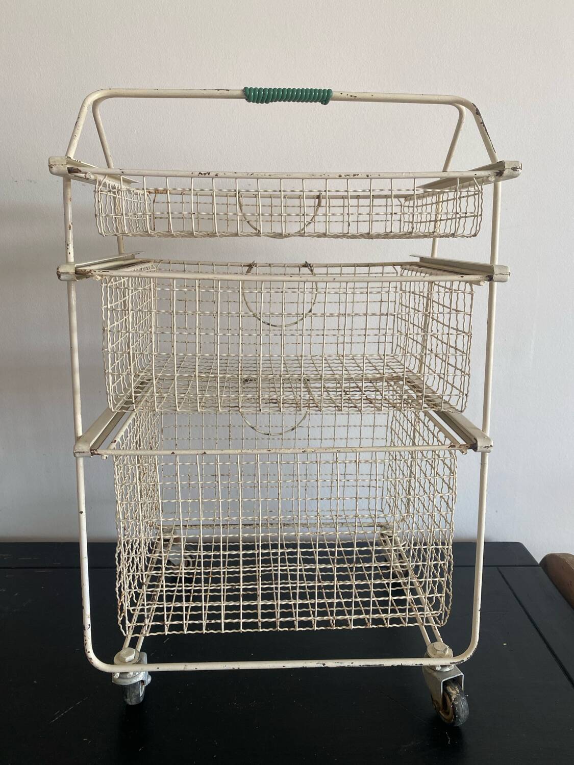 Metal serving trolley on wheels