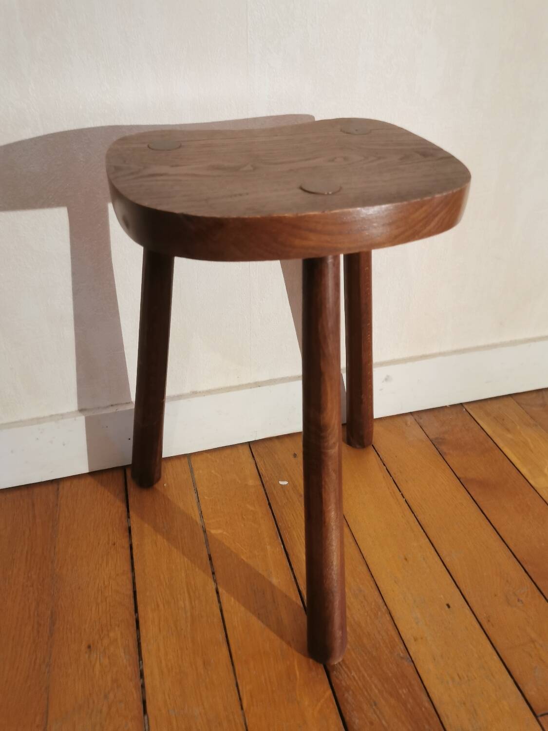 Old wooden tripod bench stool milking shepherd’s bench