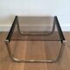 Pair of side tables in chrome, blackened wood and glass.