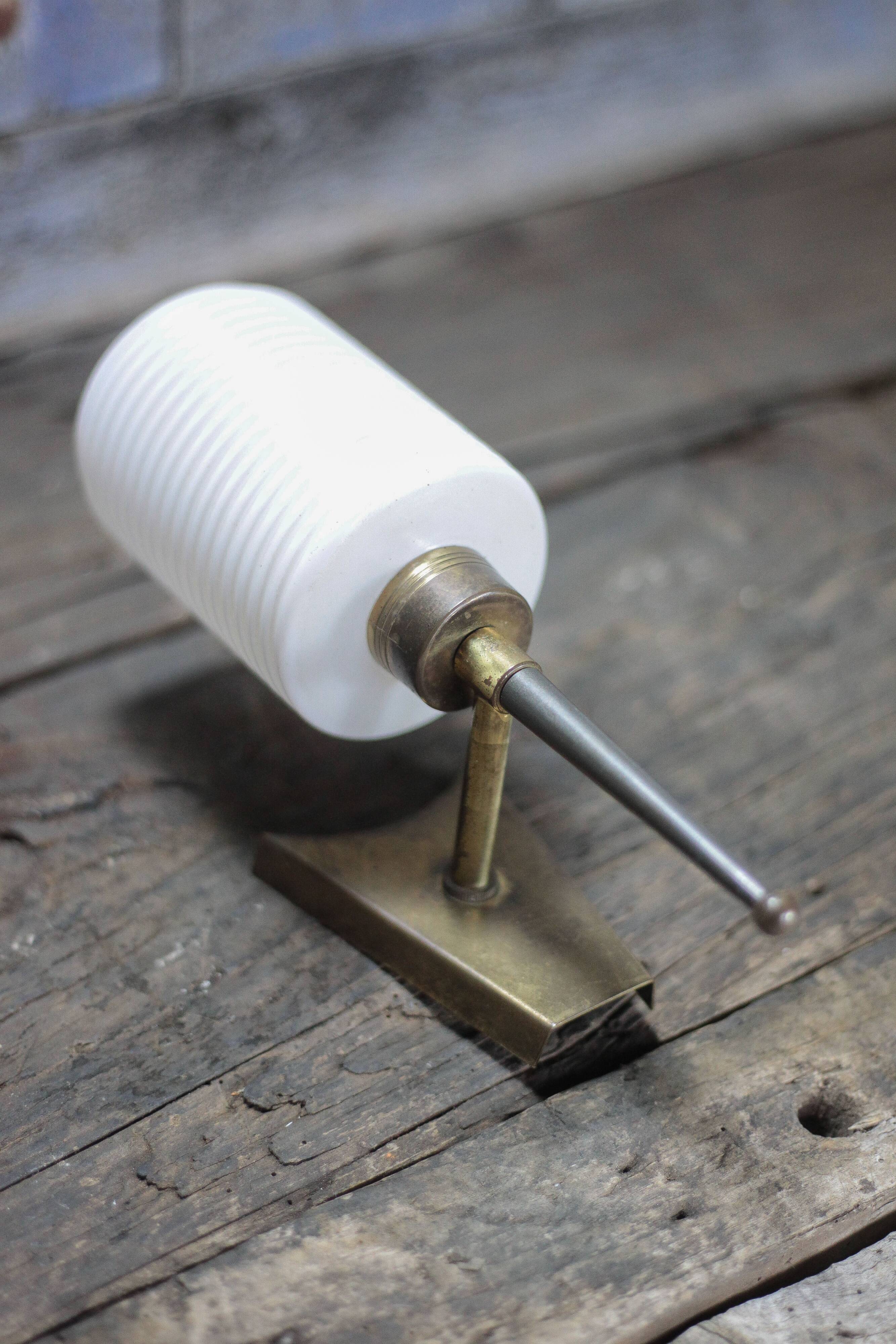 Brass wall light, black lacquered metal and white opal glass, 50s.